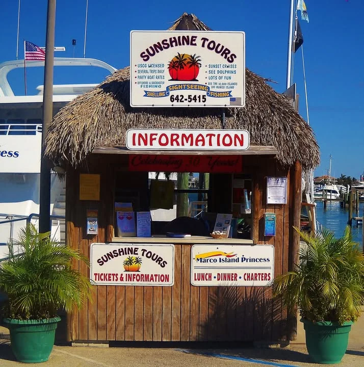 The Sunshine Tours information hut at Rose Marina with its thatched roof