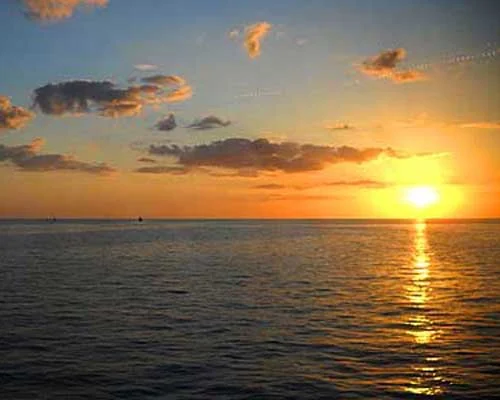 Sunset over the water from the yacht